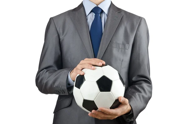 Homme d'affaires tenant le football sur blanc — Photo