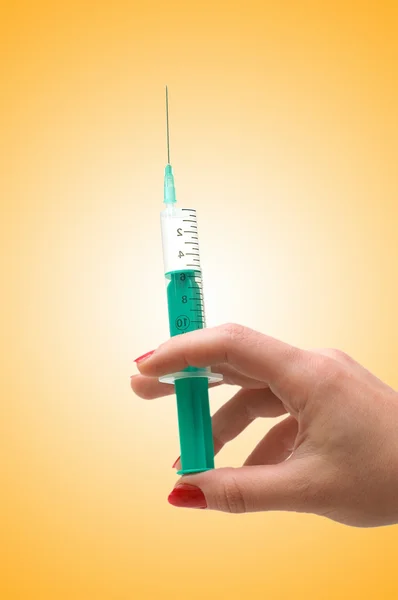 Hand holding syringe isolated on the white — Stock Photo, Image