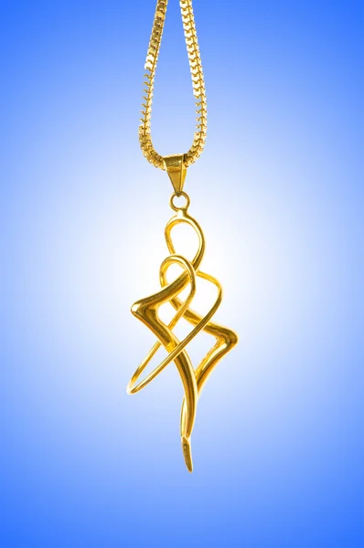 stock image Golden jewellery against gradient background