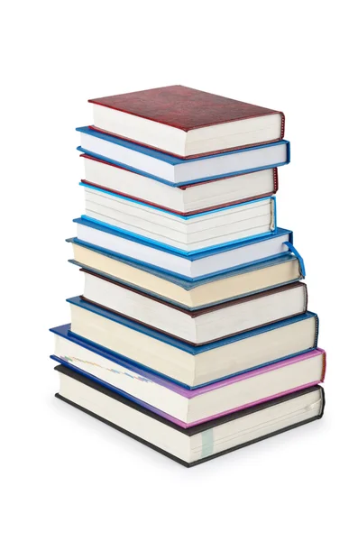 Böcker i hög stack isolerad på vitt — Stockfoto