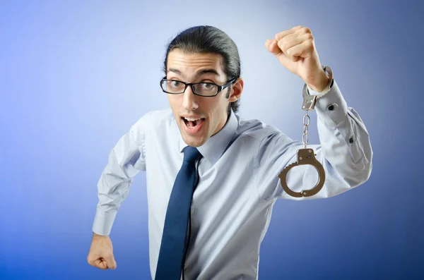Businessman with handcuffs running away — Stock Photo, Image