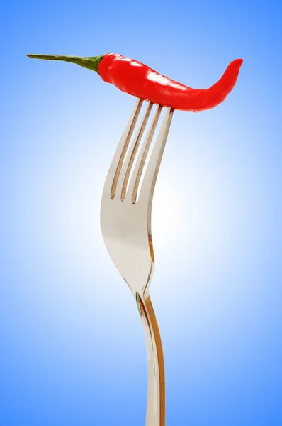 Pimienta roja en el tenedor —  Fotos de Stock