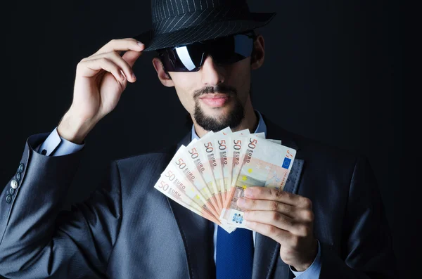 Mann mit Falschgeld — Stockfoto