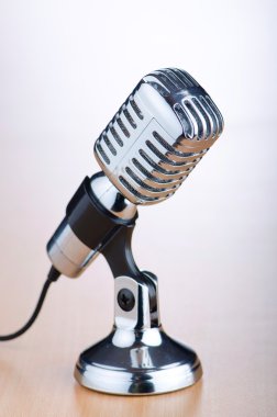 Vintage microphone against the background clipart