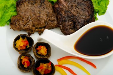 Steak with sauce in the plate clipart