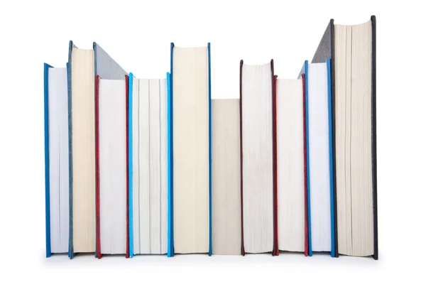 Βιβλία σε υψηλή στοίβα που απομονώνονται σε λευκό — Φωτογραφία Αρχείου
