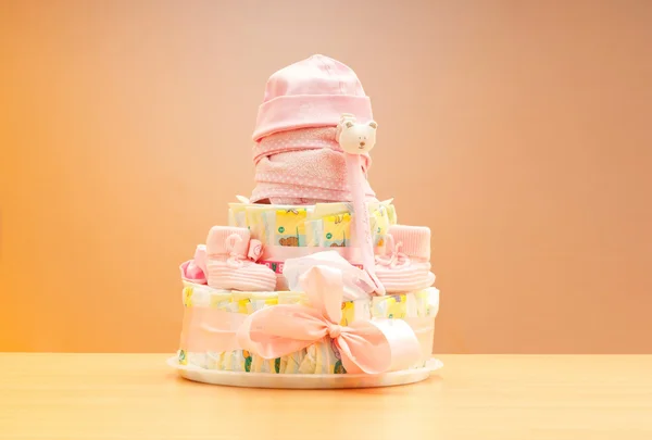 Cakes made of diapers on white — Stock Photo, Image