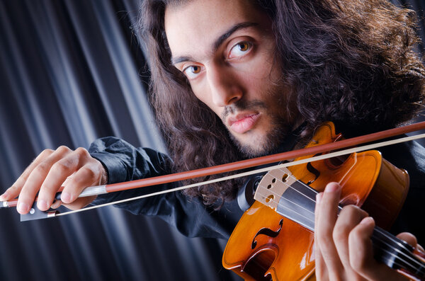Young violin player playing