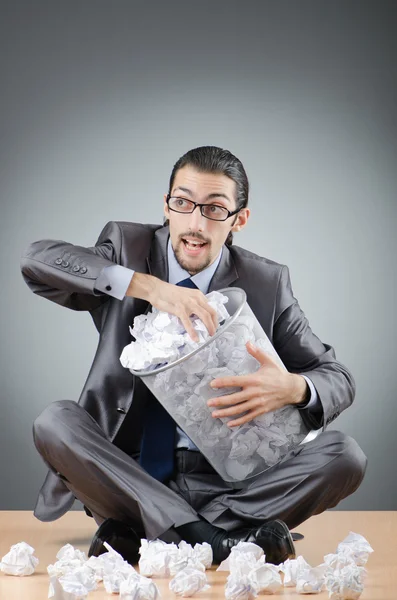 Man with lots of wasted paper Royalty Free Stock Images