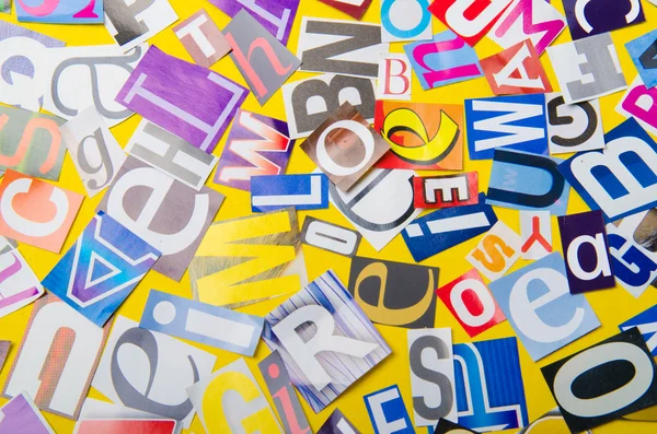 Newspaper clippings with various letters — Stock Photo, Image