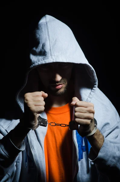 Young criminal with handcuffs — Stock Photo, Image