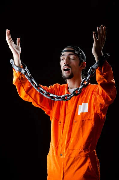 Inmate chained on black background — Stock Photo, Image