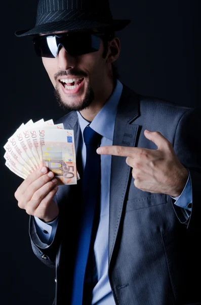 Hombre con dinero falso — Foto de Stock