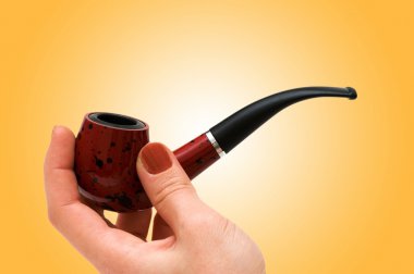 Hand with the smoking pipe clipart