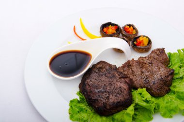 Well done steak served in the plate clipart