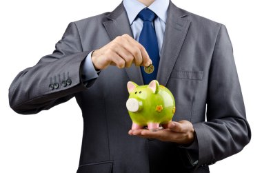 Man saving his money in the piggybank clipart