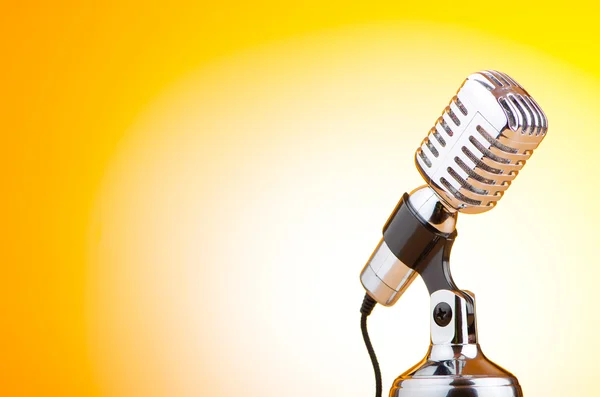 stock image Vintage microphone against the background