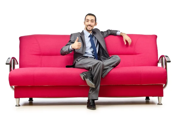 Içinde kanepede oturan adam — Stok fotoğraf