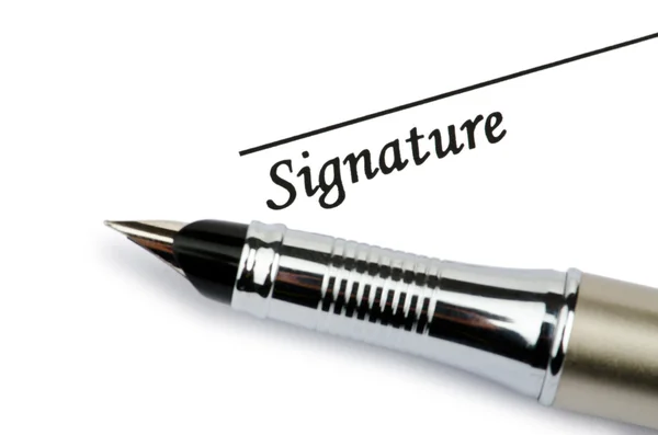 Caneta e assinatura isoladas sobre branco — Fotografia de Stock