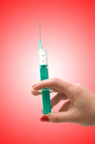 Hand holding syringe isolated on the white — Stock Photo, Image