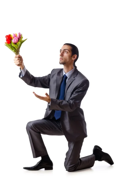 Hombre joven con flores de tulipán — Foto de Stock