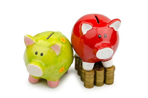 Piggy bank and coins isolated on white — Stock Photo, Image