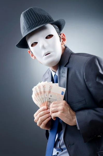 Empresário com dinheiro e máscara — Fotografia de Stock