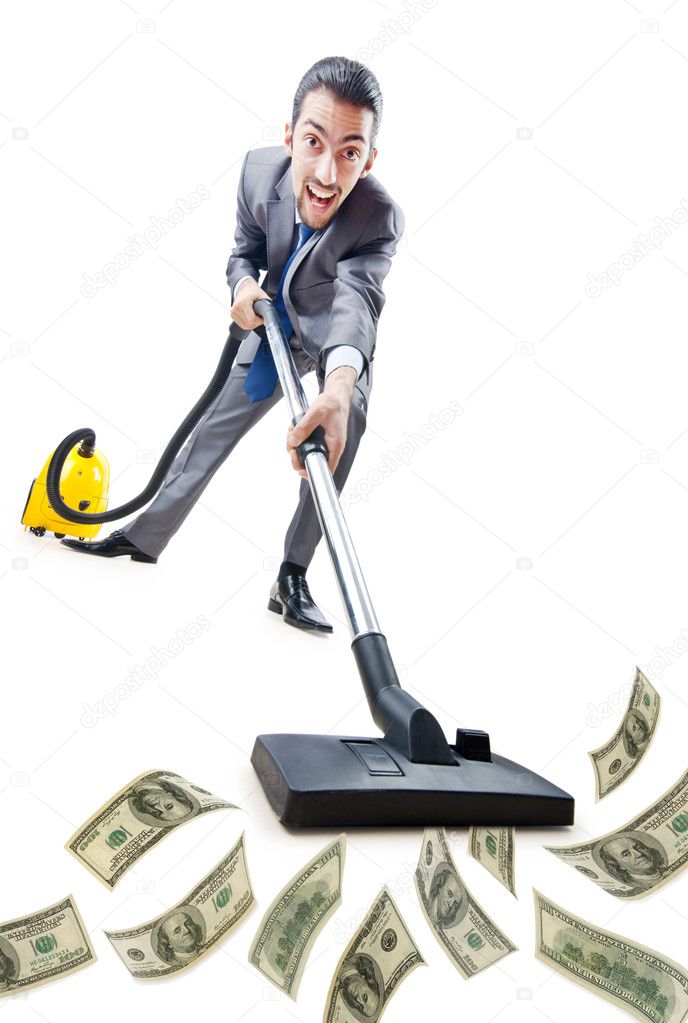 Businessman with vacuum cleaner on white