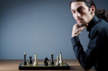 Chess player playing his game clipart