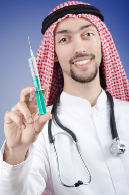 Arab doctor with syringe clipart
