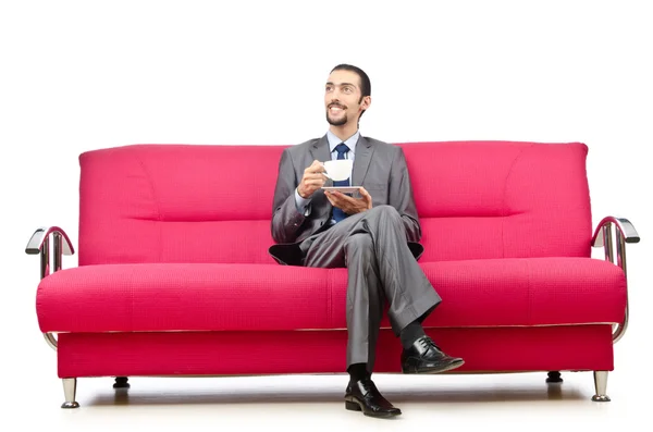 Içinde kanepede oturan adam — Stok fotoğraf