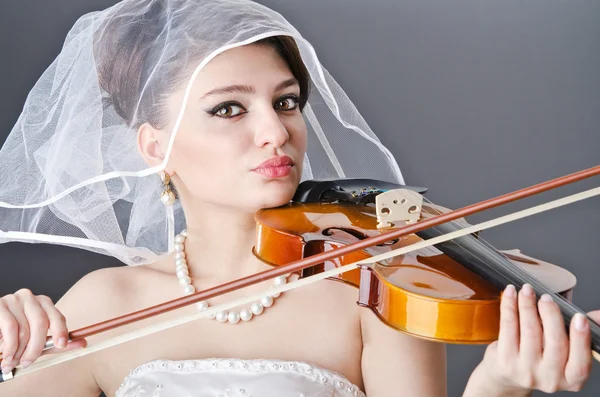 stock image Bride playing violin in studio