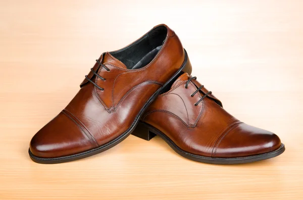 Brown shoes on wooden table — Stock Photo, Image