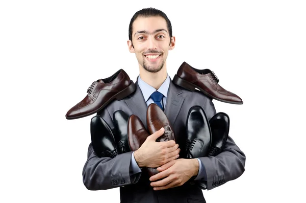 Человек с подборкой обуви — стоковое фото