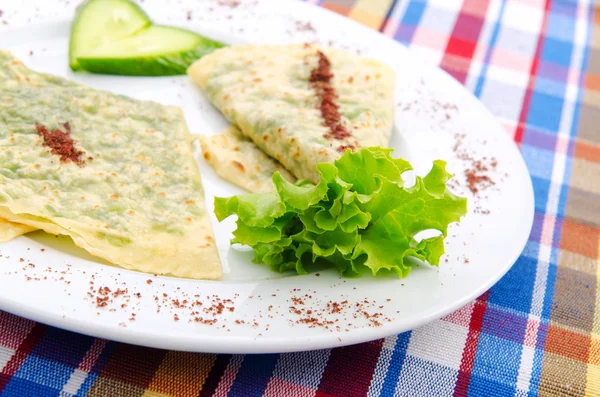 Herb stuffed pancaces in the plate — Stock Photo, Image