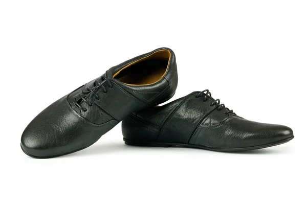 Черные женские туфли на белом — стоковое фото