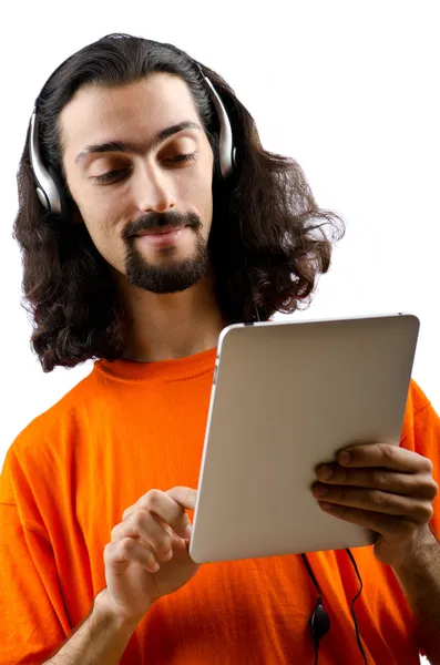 Estudante ouvir música com computador tablet — Fotografia de Stock