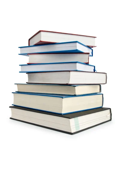 Yüksek yığın içindeki kitaplar beyaza izole edilmiş — Stok fotoğraf