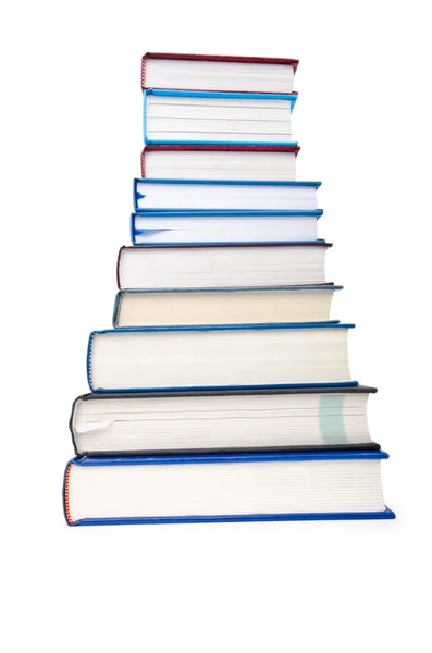 Books in high stack isolated on white — Stock Photo, Image