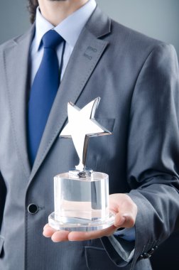 Businessman awarded with star award clipart