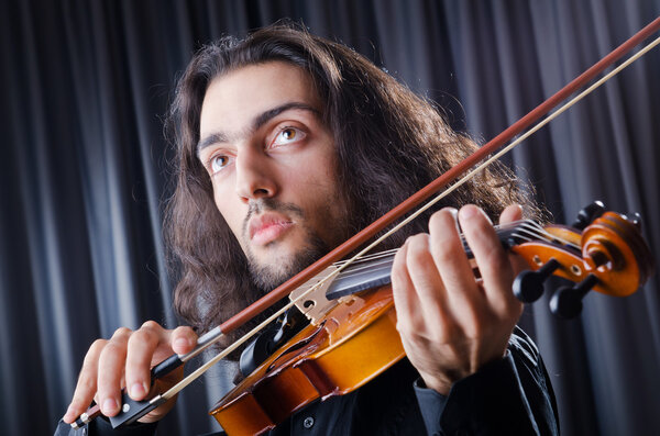 Young violin player playing