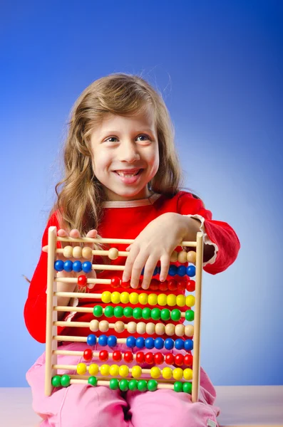 Girl playing with abacus Royalty Free Stock Photos