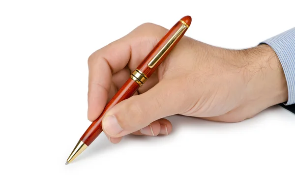 Hand med penna skriva på vit Stockbild