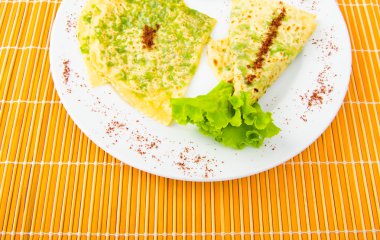 Pancake with herbs in the plate clipart