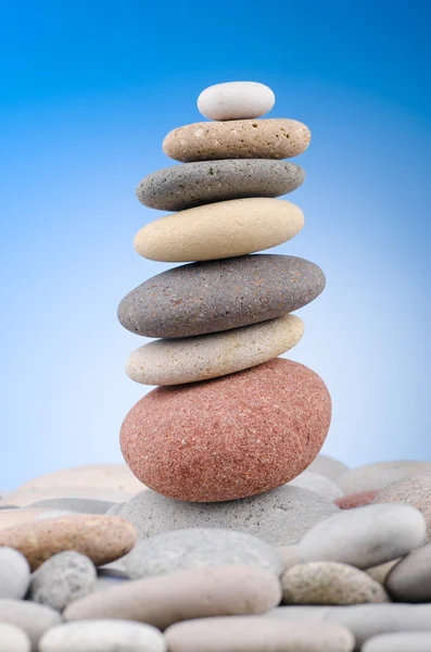 stock image Pebbles stack against gradient background