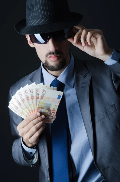 Man with counterfeir money — Stock Photo, Image