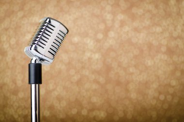 Old vintage microphone on background clipart