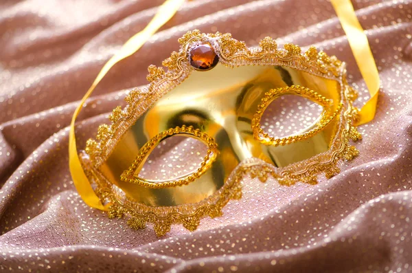 Golden mask on the satin background — Stock Photo, Image