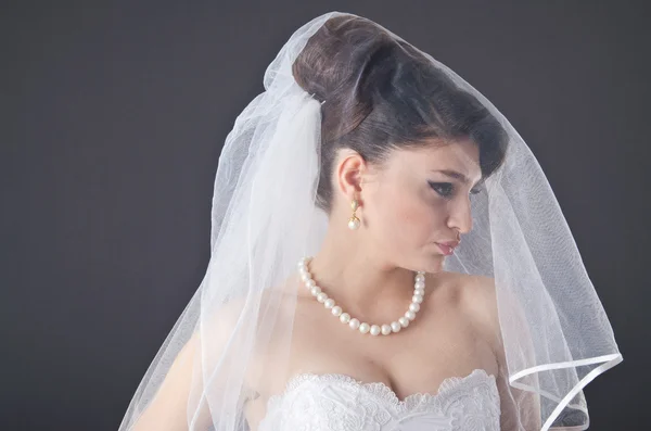 Bride in wedding dress in studio shooting — Stock Photo, Image