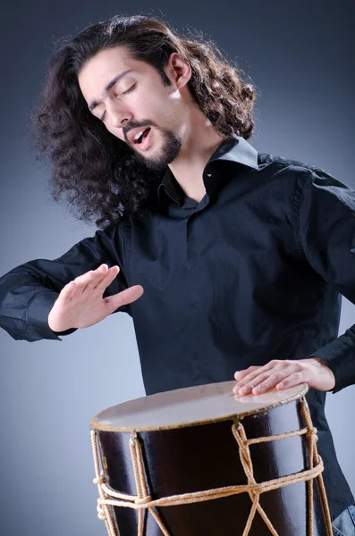 stock image Man playing drum in studio